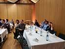 Attendees sitting at tables at the banquet