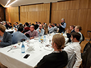 Attendees sitting at tables at the banquet