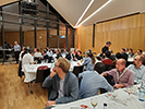 Attendees sitting at tables at the banquet