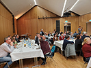 Attendees sitting at tables at the banquet