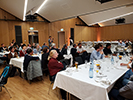 Attendees sitting at tables at the banquet