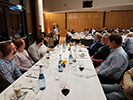 Attendees sitting at tables at the banquet