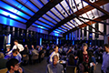 workshop attendees eating and listening to speakers at the banquet