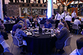 workshop attendees eating and listening to speakers at the banquet