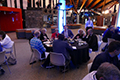 workshop attendees eating and listening to speakers at the banquet