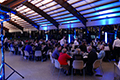 workshop attendees eating and listening to speakers at the banquet