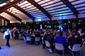 workshop attendees eating and listening to speakers at the banquet