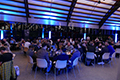 workshop attendees eating and listening to speakers at the banquet