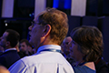 workshop attendees eating and listening to speakers at the banquet