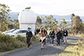 attendees taking a tour of Mount Stromlo Observatory