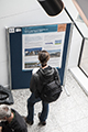 workshop attendees walking around and looking at the posters