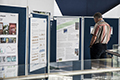 workshop attendees walking around and looking at the posters