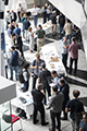 workshop attendees walking around and looking at the posters