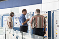 workshop attendees walking around and looking at the posters