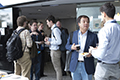 workshop attendees walking around and looking at the posters