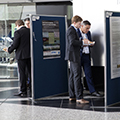 workshop attendees walking around and looking at the posters